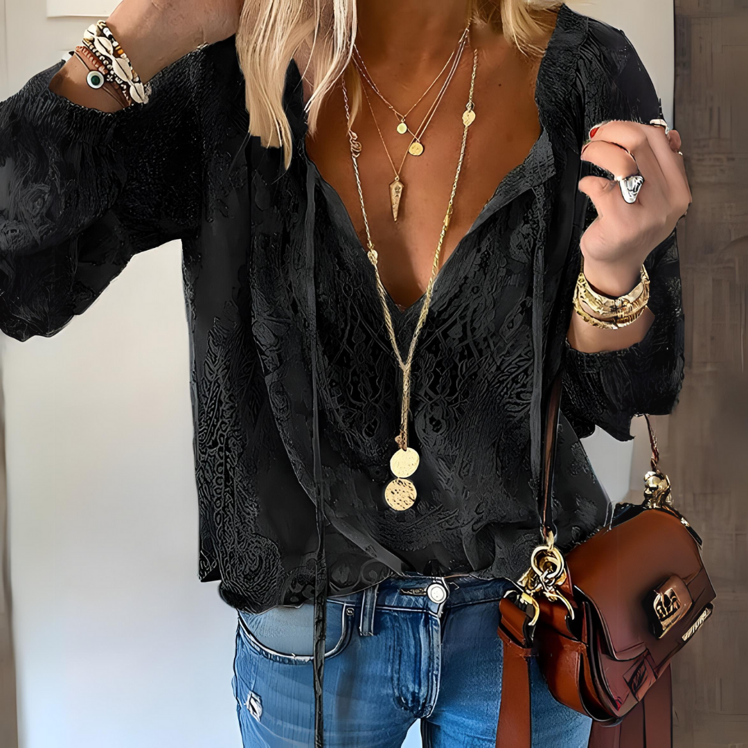 Blusa femenina con encaje y lazo elegante
