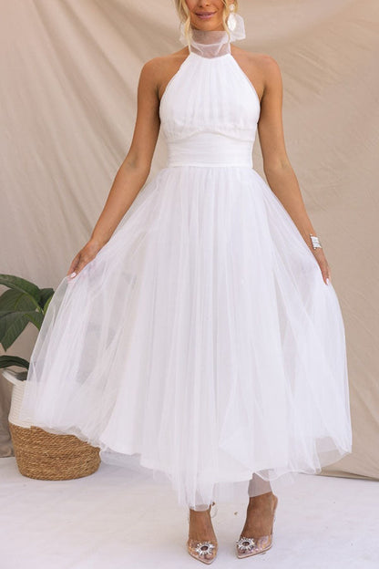 Vestido Midi Elegante con Escote Halter y Falda Aireada