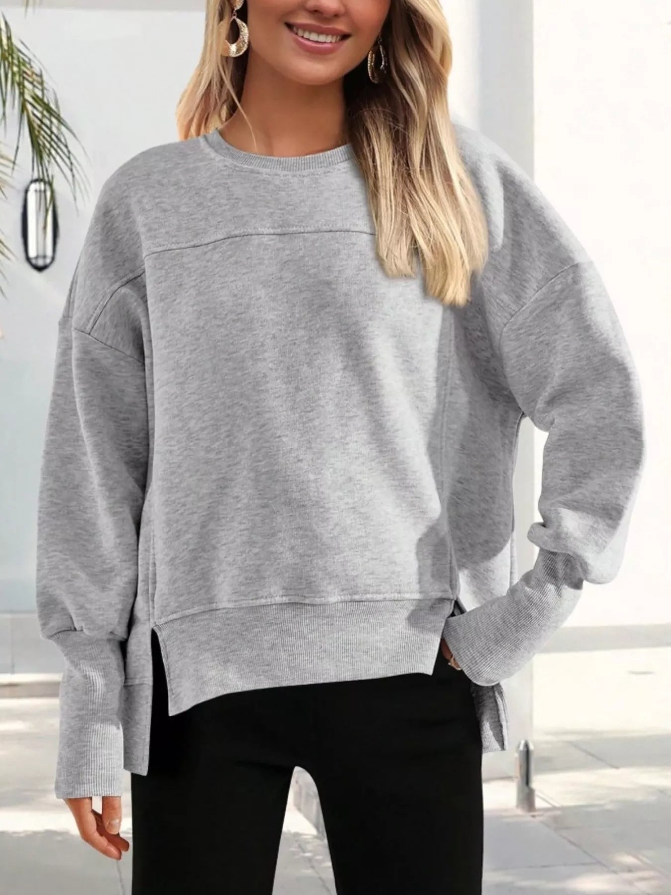 Sudadera deportiva holgada con corte lateral