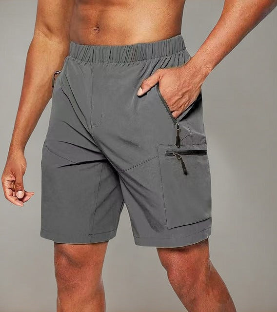 Pantalón corto deportivo hombre con bolsillo cremallera