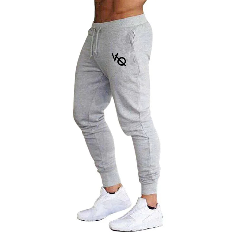 Pantalones deportivos ajustados hombre tobillo elástico