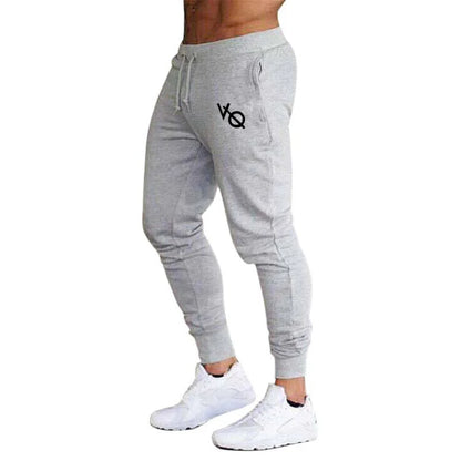 Pantalones deportivos ajustados hombre tobillo elástico