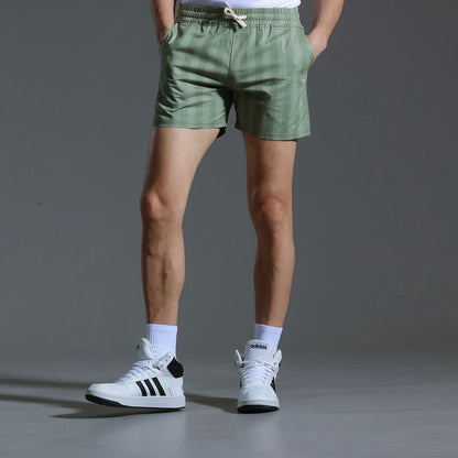 Pantalones cortos deportivos hombre rayas verticales
