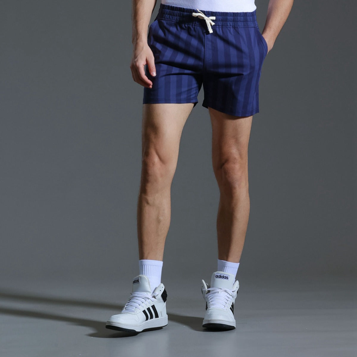 Pantalones cortos deportivos hombre rayas verticales