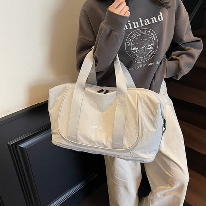 Bolso de mano deportivo para mujer de tejido resistente