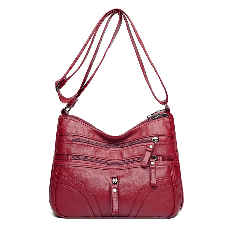 Bolso bandolera elegante con cremallera y detalles femeninos